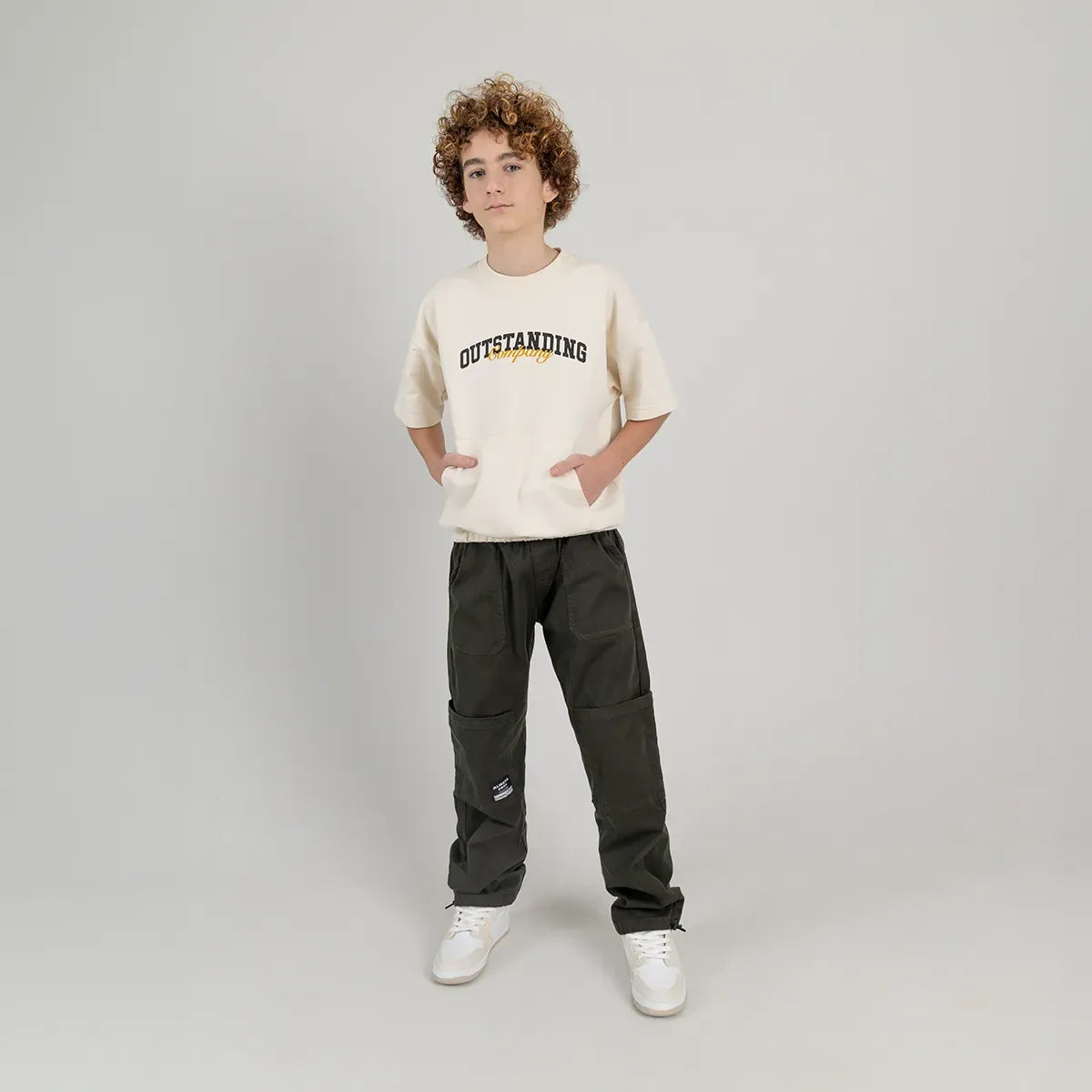 Camiseta oversize para niño manga corta con bolsillo en el frente