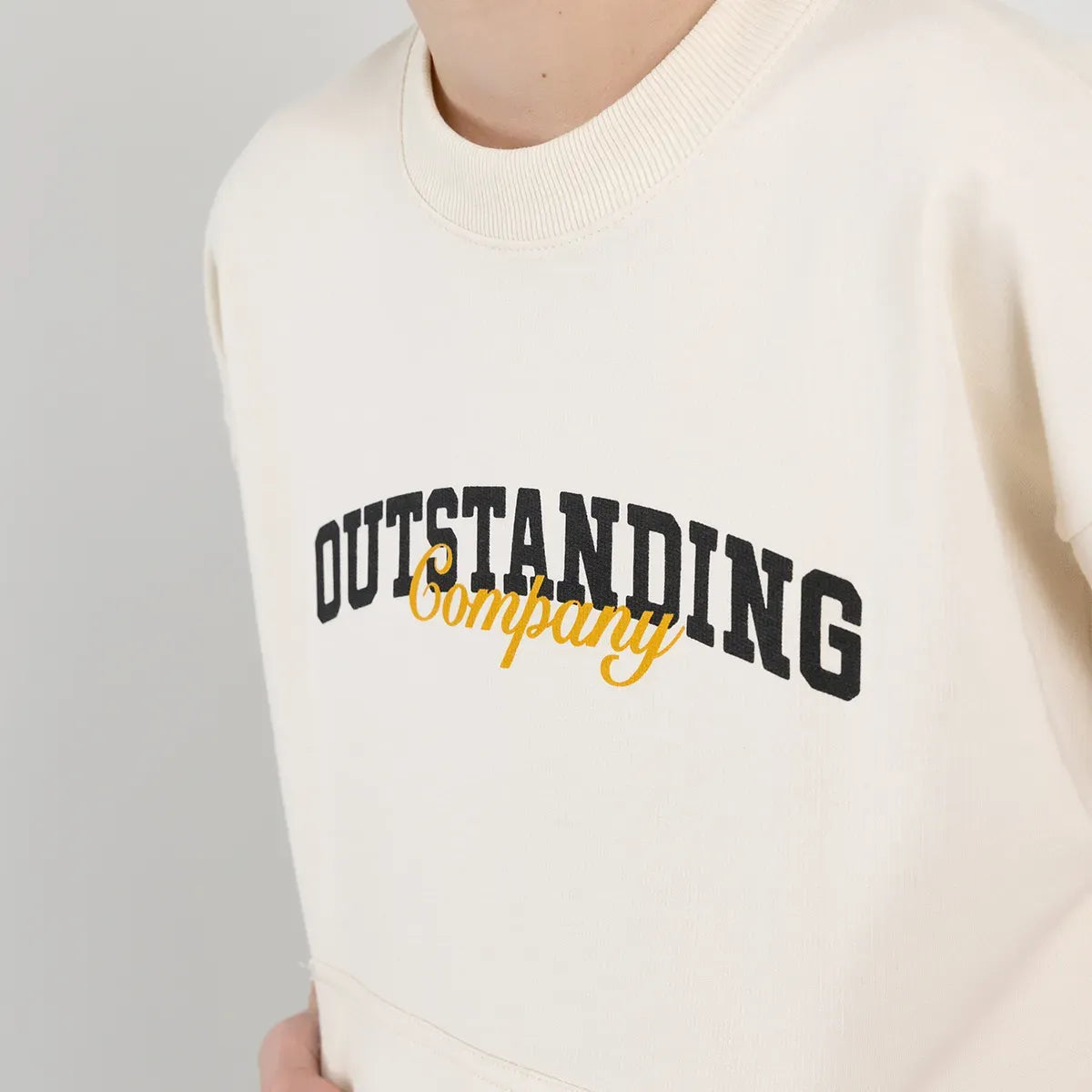 Camiseta oversize para niño manga corta con bolsillo en el frente